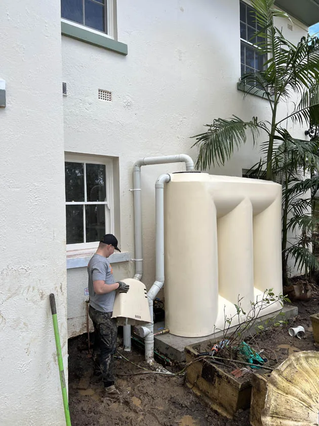 Downpipes connected into a slimline tank and stormwater line